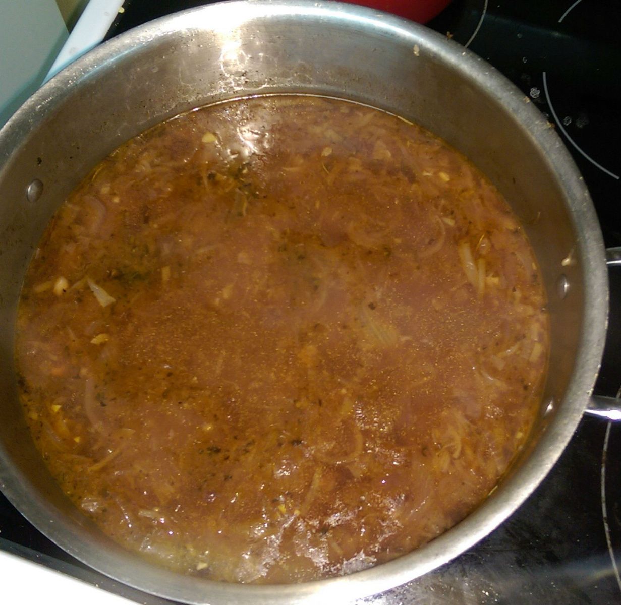 Broth added to onions